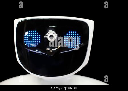 Robot face with electronic eyes on a black background. Stock Photo