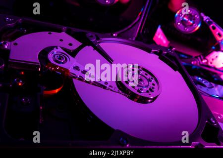 Close up of the open case of a computer hard drive showing the disc and internal workings. Stock Photo