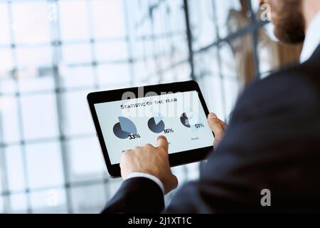 business man analyzing the annual data on cryptocurrency. Stock Photo