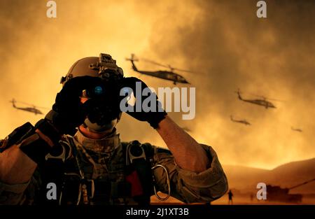 Military soldier looking through binoculars in battle field at war at sunset Stock Photo