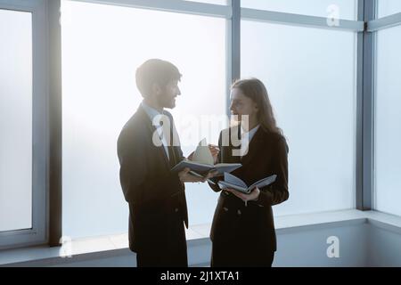 business colleagues discussing business matters late at night. Stock Photo
