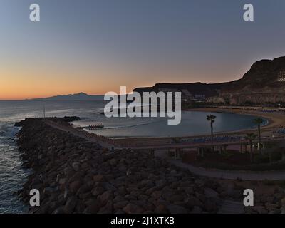 Beautiful view over popular beach Playa de Amadores in tourist resort Puerto Rico on the southern coast of Gran Canaria, Canary Islands, Spain. Stock Photo