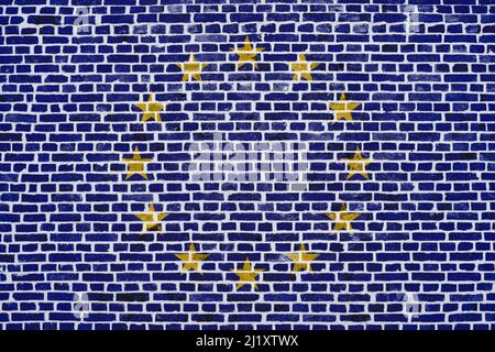 Close-up on a brick wall with the flag of the European Union painted on it. Stock Photo