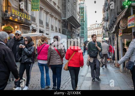 Naples, Italy - March 24, 2022: Via Toledo, in the historic center of the city people walk the street on a spring day, looking for shopping, leisure o Stock Photo