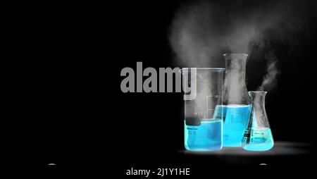 Flasks with blue liquid isolated on black background with smoke Stock Photo