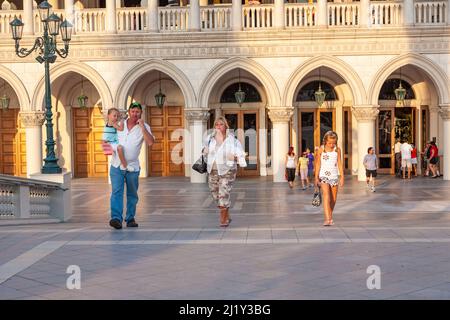 Las Vegas, USA - June 17, 2008:people enjoy the promenade at The Venetian Resort Hotel & Casino. The resort opened on May 3, 1999 with flutter of whit Stock Photo