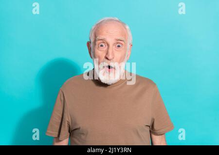 Portrait of attractive funky amazed grey-haired man sudden incredible news reaction isolated over shine blue color background Stock Photo