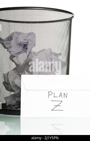 White envelope with plan z written on it, next to a bin full of paper balls. Conceptual photograph showing the concepts of planning for the future, pe Stock Photo