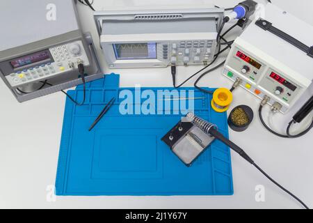 Power supplies and electronic measuring devices in the laboratory.Electronic measuring instruments in science lab. Stock Photo