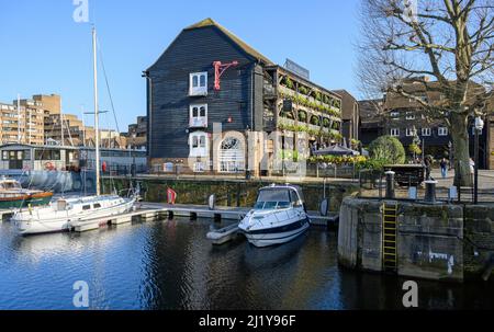 St Katharine Docks, London, UK: The Dickens Inn at St Katharine Docks Marina in Wapping near the City of London. Stock Photo