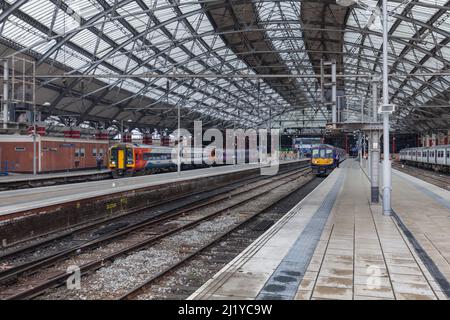 Liverpool Lime Street  railway station with Northern rail class 319 electric train and East Midlands trains class 158 diesel sprinter train Stock Photo