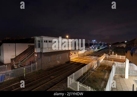 Redcar Central signal box at night with the unique power operated sliding barrier level crossing Stock Photo