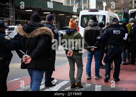 New York City, USA. 28th Mar, 2022. Housing and climate activists are arrested in front of Governor Kathy Hochul's office after obstructing traffic calling for the repeal of 421-a, no more tax breaks for landlords, and a ban on gas infrastructure in new construction on March 28, 2022 (Photo by Karla Coté/Sipa USA) Credit: Sipa USA/Alamy Live News Stock Photo