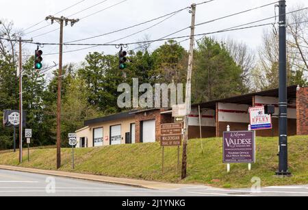 VALDESE, NC, USA-24 MARCH 2022: Street signs noting the entrance to Valdese and various points of interest in the town. Stock Photo