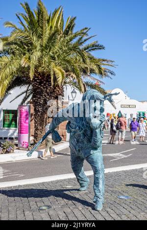 Elegua - bronze statue of man in bulls mask by Rigoberto Camacho Perez, in Teguise, Lanzarote, Spain on 13 March 2022 Stock Photo