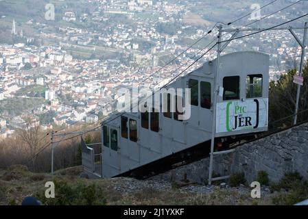 Lourdes, France : 2022 March 27 : Funicluar and Cityscape of Lourdes in France from Funicular Pic de Jer in Winter. Stock Photo