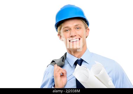 Where can I set up. Shot of a handsome young contractor standing alone in the studio and holding blueprints. Stock Photo