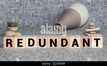 Redounding A letter on a wooden table - redundancy plan Stock Photo - Alamy