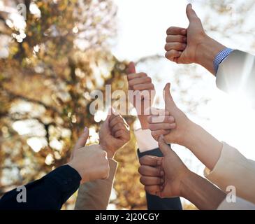 As a team. Cropped shot of unrecognizable businesspeople coming together as a team. Stock Photo