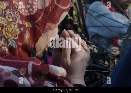 March 27, 2022, Lahore, Punjab, Pakistan: Pakistani devotees and Malangs attend the three-days 434th annual Urs 'Festival of lights' at the shrine of Muslim Sufi saint Shah Hussain, popularly known as Madho Lal Hussain in Lahore. The annual 3 days festival was held at Madhu Lal's shrine on his 434th birth anniversary. Mela Charaghan has its own importance in Lahore's history, as it has been a biggest festival of Lahore in some times.The festival was started with the seasonal Baisakhi festival in old times. Foolproof security arrangements have been made for the devotees. The last day of the Urs Stock Photo