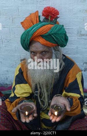 March 27, 2022, Lahore, Punjab, Pakistan: Pakistani devotees and Malangs attend the three-days 434th annual Urs 'Festival of lights' at the shrine of Muslim Sufi saint Shah Hussain, popularly known as Madho Lal Hussain in Lahore. The annual 3 days festival was held at Madhu Lal's shrine on his 434th birth anniversary. Mela Charaghan has its own importance in Lahore's history, as it has been a biggest festival of Lahore in some times.The festival was started with the seasonal Baisakhi festival in old times. Foolproof security arrangements have been made for the devotees. The last day of the Urs Stock Photo