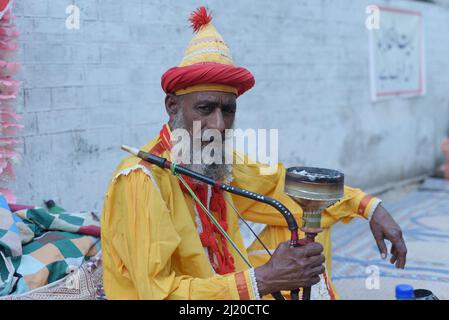 March 27, 2022, Lahore, Punjab, Pakistan: Pakistani devotees and Malangs attend the three-days 434th annual Urs 'Festival of lights' at the shrine of Muslim Sufi saint Shah Hussain, popularly known as Madho Lal Hussain in Lahore. The annual 3 days festival was held at Madhu Lal's shrine on his 434th birth anniversary. Mela Charaghan has its own importance in Lahore's history, as it has been a biggest festival of Lahore in some times.The festival was started with the seasonal Baisakhi festival in old times. Foolproof security arrangements have been made for the devotees. The last day of the Urs Stock Photo