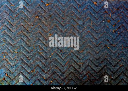 Up down pattern on blue carpet texture that is very dirty. Stock Photo