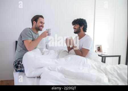 Gay couple drinking coffee in the morning Stock Photo