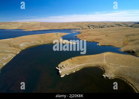 Logan Burn Reservoir (aka Great Moss Swamp), by Old Dunstan Trail, Central Otago, South Island, New Zealand - drone aerial Stock Photo