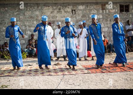 Zanzibar, Tanzania-January 05,2022: Local people dressed in traditional attire perform a musical dance performance. Stock Photo