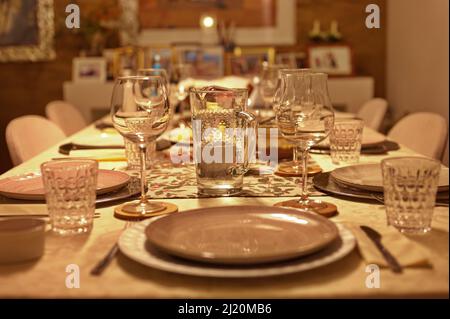 Table setting for dinner in living room Stock Photo