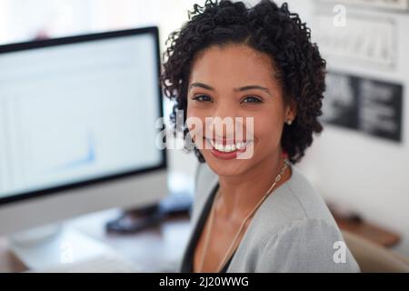 She doesnt quit till the job is perfect. Portrait of a young businesswoman in the office. Stock Photo