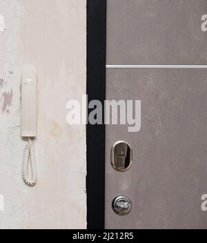 Intercom on a wall near door Stock Photo