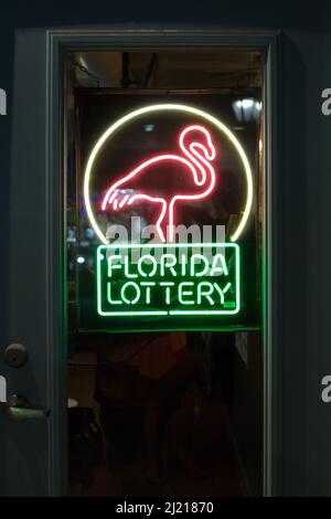 Key West, Florida USA - May 10, 2018. Florida lottery logo neon sign on a shop door at Ducal Street. Stock Photo