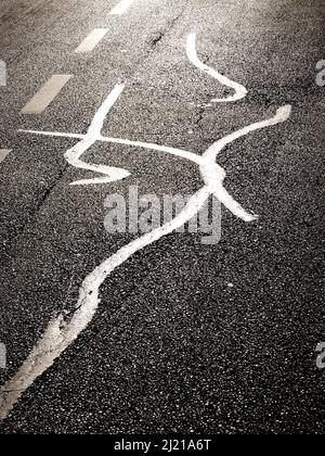 Seamless pattern on asphalt road. Asphalt road reflecting evening sunlight. Stock Photo