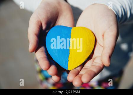 Donation concept. Heart and Ukrainian National colors with text