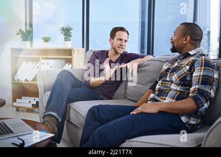 Discussing ideas on how to expand their business. Cropped shot of two designers working together in the office. Stock Photo