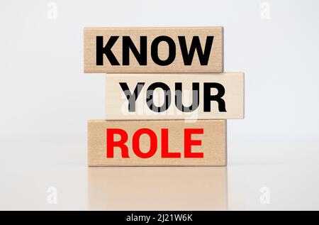 Know Your Role A business message text written on a black leather background Stock Photo