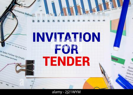 Blank sheet, pen and crumpled paper balls on grey table, flat lay. Text INVITATION FOR TENDER. Stock Photo