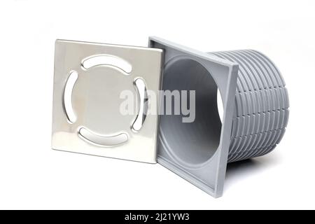 Close up of grey plastic bathroom patio terrace drain to be embedded in the ground with stainless steel metal grating cover on white background Stock Photo