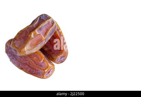 Closeup photo of dried dates isolated on white background. Stock Photo