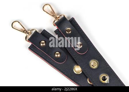 Black belts with metal carabine clasp. Isolated on white background. Stock Photo