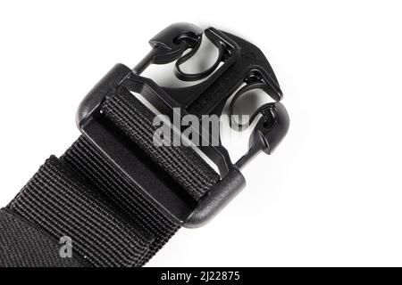 black plastic Fastex clip for backpacks on a white background. items of clothing and equipment. Stock Photo