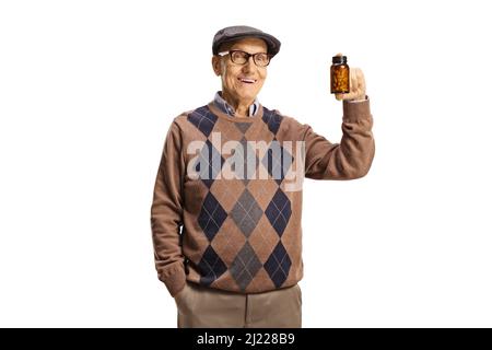 Elderly man holding a bottle of pills and smiling isolated on white background Stock Photo