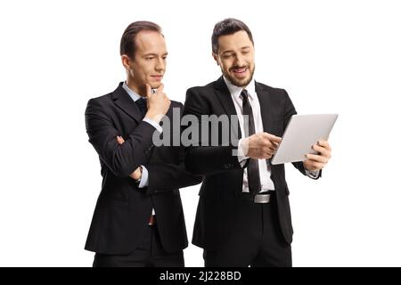 Two professional men looking at a digital tablet isolated on white background Stock Photo