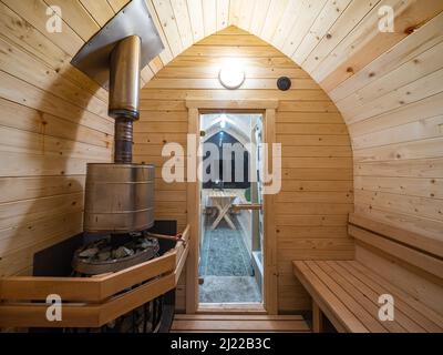 Interior of wooden finnish sauna. Classic bathhouse. SPA concept. Stock Photo