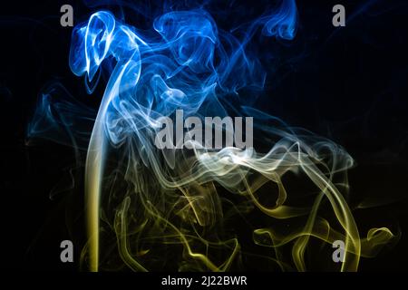 Helsinki / Finland - MARCH 29, 2022: Concept of abstract smoke colored with the colors of the Ukrainian flag Stock Photo