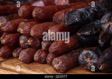 Handmade smoked sausages on food market Stock Photo