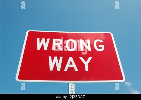 Wrong Way driving sign on highway as warning to drivers Stock Photo
