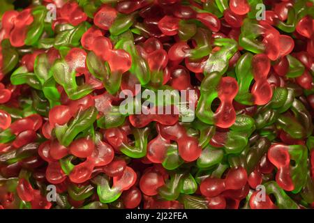 Multicolored jelly stick candies textured background. Stock Photo